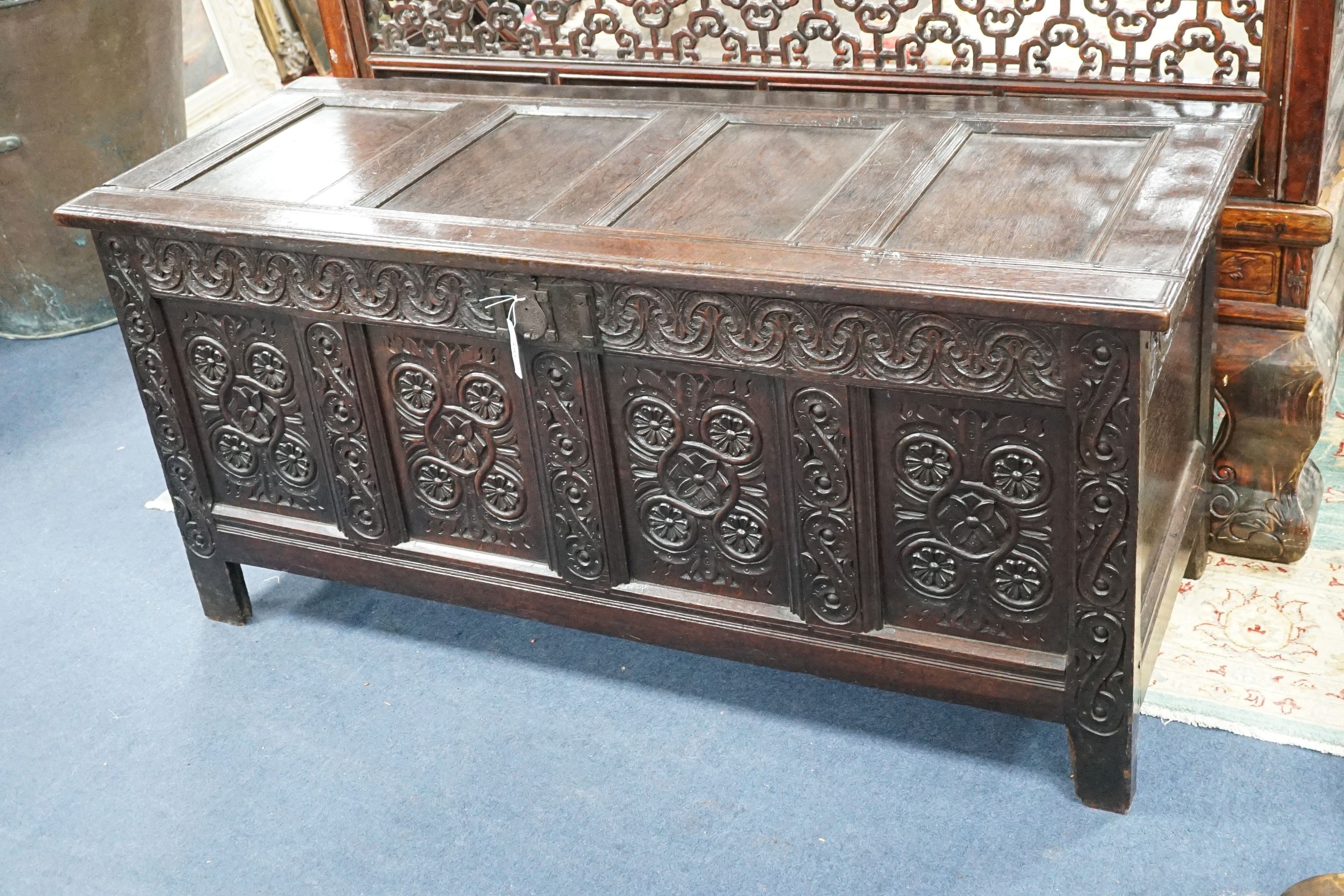 A 17th century Gloucestershire area carved, panelled oak coffer, length 150cm, depth 58cm, height 69cm